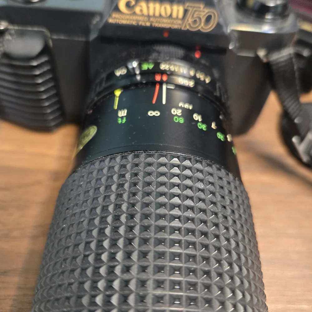 Canon Black SLR Camera with Textured Zoom Lens